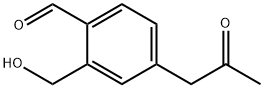 2-(Hydroxymethyl)-4-(2-oxopropyl)benzaldehyde Structure