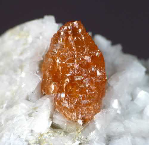 FIGURE 7.20 Parisite-(Ce), CaCe2(CO3)3F2, translucent crystal to 9 mm.