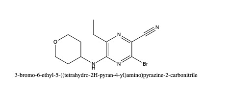 3-bromo-6-ethyl-5-((tetrahydro-2H-pyran-4-yl)amino)pyrazine-2-carbonitrile